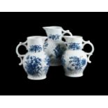 THREE VARIOUS WORCESTER BLUE AND WHITE PRINTED CABBAGE LEAF MOULDED MASK JUGS