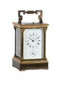 A BRASS BUSH BUTTON REPEATING CARRIAGE CLOCK
