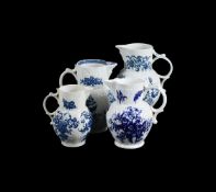 THREE VARIOUS WORCESTER AND CAUGHLEY BLUE AND WHITE PRINTED CABBAGE LEAF MOULDED MASK JUGS