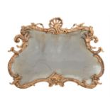 A GEORGE III CARVED GILTWOOD WALL MIRROR