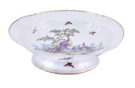 A WORCESTER PEDESTAL QUATREFOIL DESSERT DISH PAINTED WITH EXOTIC BIRDS IN THE MANNER OF GEORGE DAVIS