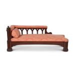 A GOTHIC REVIVAL MAHOGANY AND UPHOLSTERED DAYBED, IN THE MANNER OF A. W. N. PUGIN