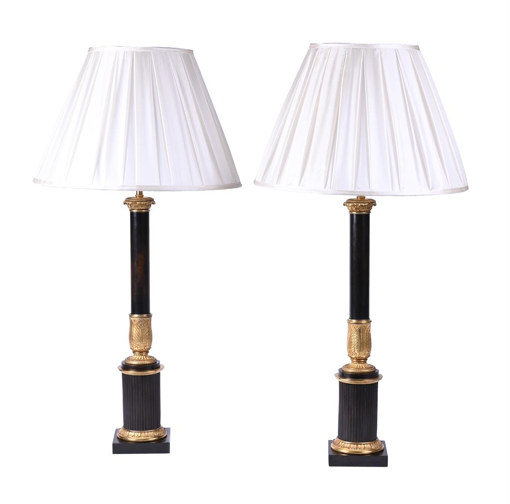 A PAIR OF PATINATED AND GILT METAL TABLE LAMPS IN EMPIRE STYLE