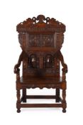 A CARVED OAK ARMCHAIR IN 17TH CENTURY STYLE