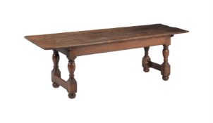 AN OAK REFECTORY DINING TABLE IN 18TH CENTURY STYLE