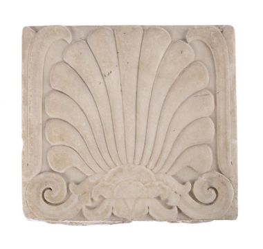 A CARVED MARBLE RELIEF OF A PALMETTE