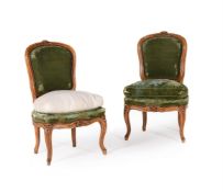 A PAIR OF WALNUT AND GREEN UPHOLSTERED SIDE CHAIRS IN FRENCH TASTE