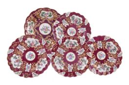 A SELECTION OF WORCESTER CLARET-GROUND AND GILT LATER DECORATED PORCELAIN PLATES