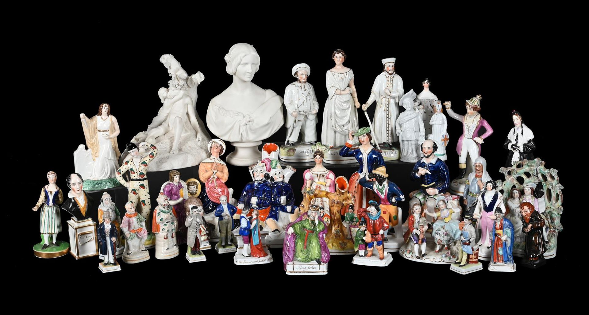 AN ASSORTMENT OF MOSTLY STAFFORDSHIRE POTTERY THEATRICAL GROUPS AND FIGURES