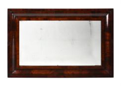 A WILLIAM IV MAHOGANY CUSHION FRAMED WALL MIRROR