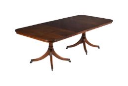 A MAHOGANY DINING TABLE IN REGENCY STYLE