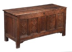 AN OAK PANELLED CHEST