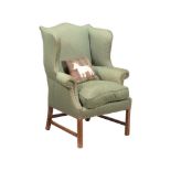 A WING ARMCHAIR IN GEORGE III STYLE