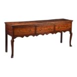 A GEORGE III OAK AND ELM DRESSER BASE