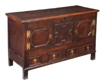 AN OAK CHEST OF MULE FORM