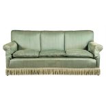A GREEN UPHOLSTERED THREE SEAT SOFA