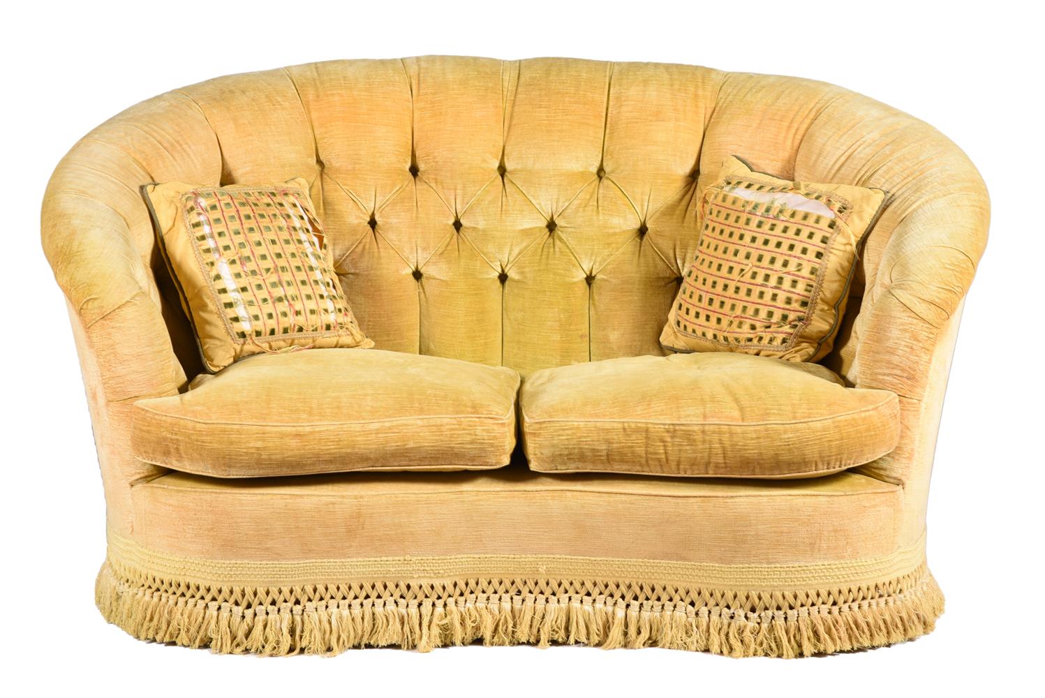 A YELLOW KIDNEY SHAPED SOFA