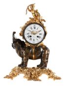 A FINE FRENCH LOUIS XV STYLE PATINATED AND GILT BRONZE MANTEL CLOCK ‘PENDULE A L’ELEPHANT’