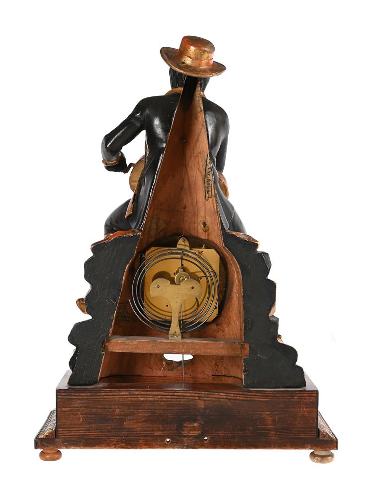 AN UNUSUAL AUSTRIAN BIEDERMEIER CARVED PARCEL GILT FIGURAL MANTEL CLOCK WITH ‘ROCKING EYE’ AUTOMATON - Image 4 of 5