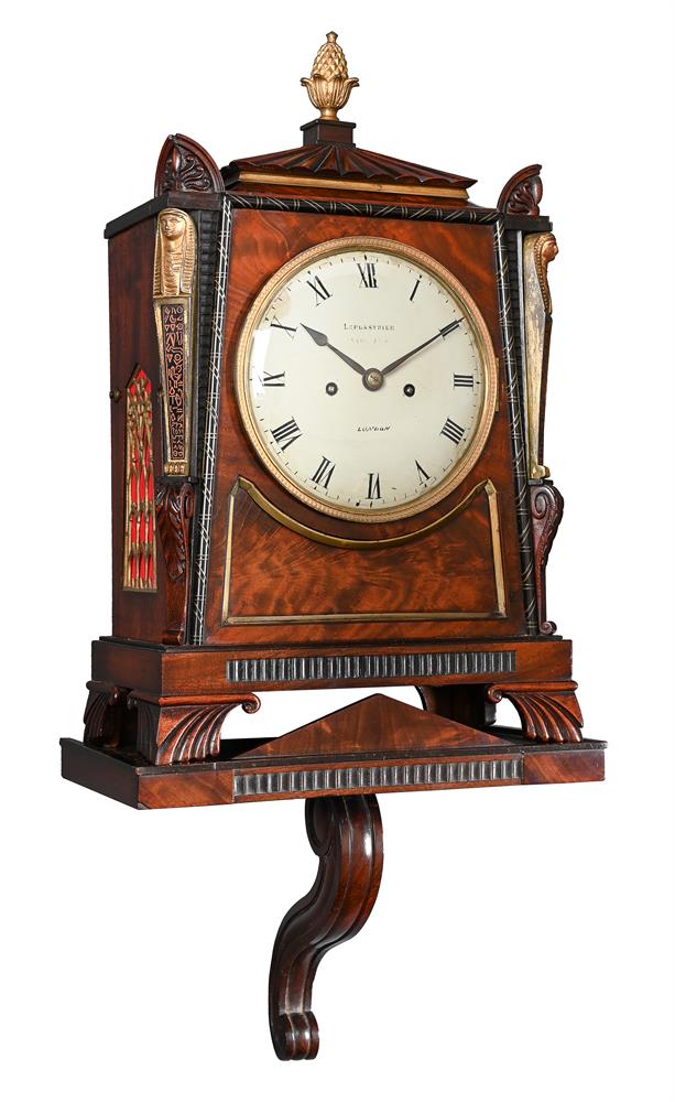 A REGENCY BRASS MOUNTED MAHOGANY BRACKET CLOCK IN THE MANNER OF THOMAS HOPE WITH WALL BRACKET