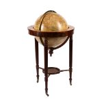 A GEORGE III/REGENCY EIGHTEEN-INCH CELESTIAL FLOOR-STANDING LIBRARY GLOBE