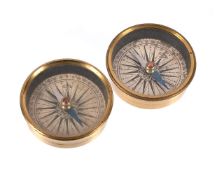 A PAIR OF FRENCH LACQUERED BRASS COMPASS DIALS