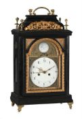 AN AUSTRIAN EBONISED SMALL TABLE CLOCK WITH CONCENTRIC CALENDAR AND TRIP-HOUR REPEAT