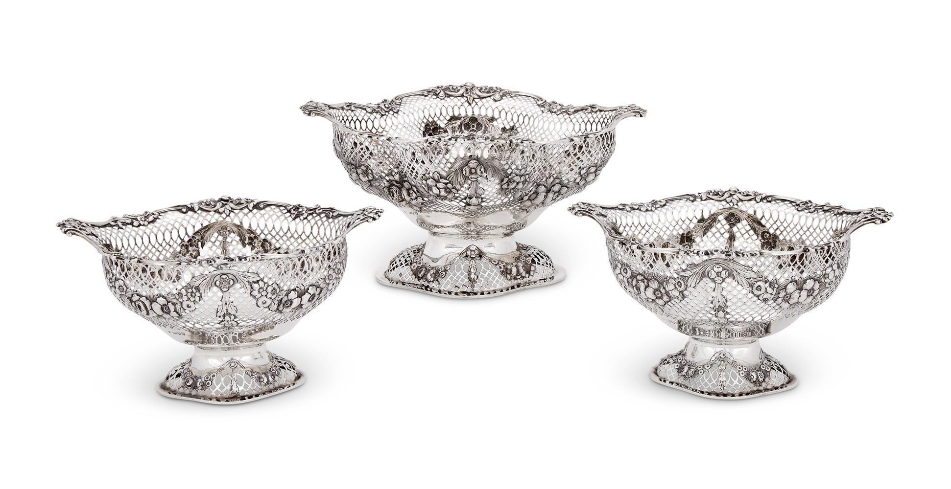 A SET OF THREE VICTORIAN SILVER SHAPED OVAL PIERCED BASKETS
