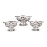 A SET OF THREE VICTORIAN SILVER SHAPED OVAL PIERCED BASKETS