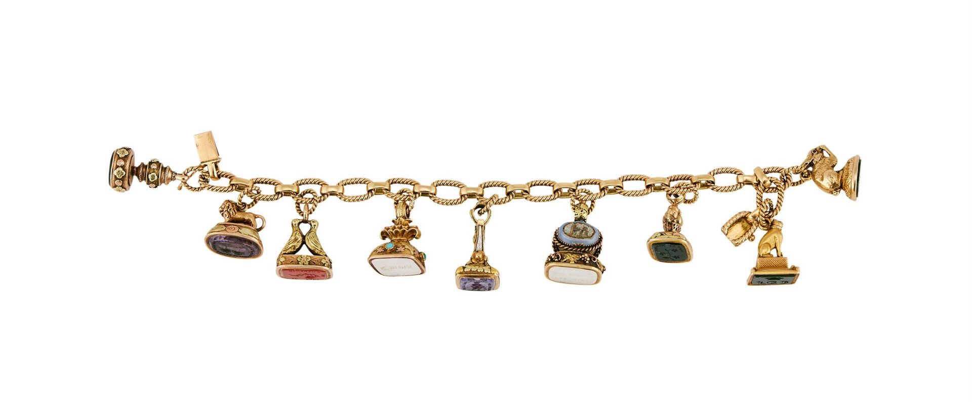 A MID 20TH CENTURY FRENCH BRACELET SUSPENDING VARIOUS 19TH CENTURY FOBS