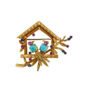 A FRENCH 1960S SAPPHIRE, RUBY, TURQUOISE AND GOLD COLOURED BIRDHOUSE BROOCH