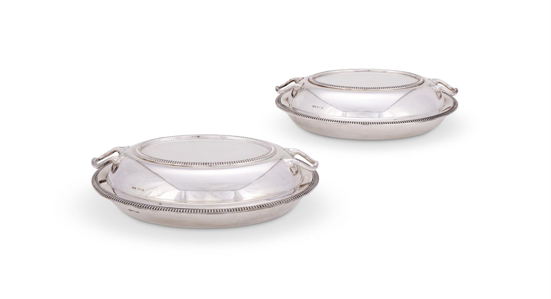 A PAIR OF SILVER OVAL TUREENS AND COVERS