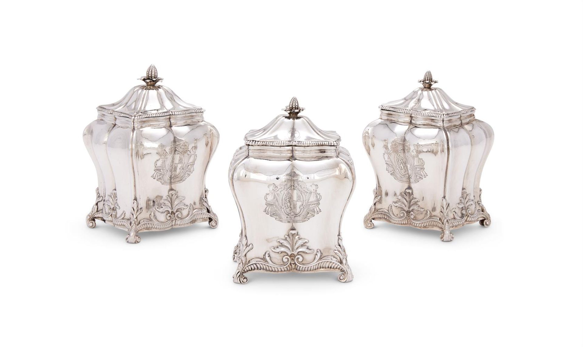 A SET OF THREE GEORGE III SILVER TEA CADDIES