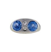 A SAPPHIRE AND DIAMOND FOUR STONE RING