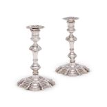 A MATCHED PAIR OF GEORGE II CAST SILVER CANDLESTICKS
