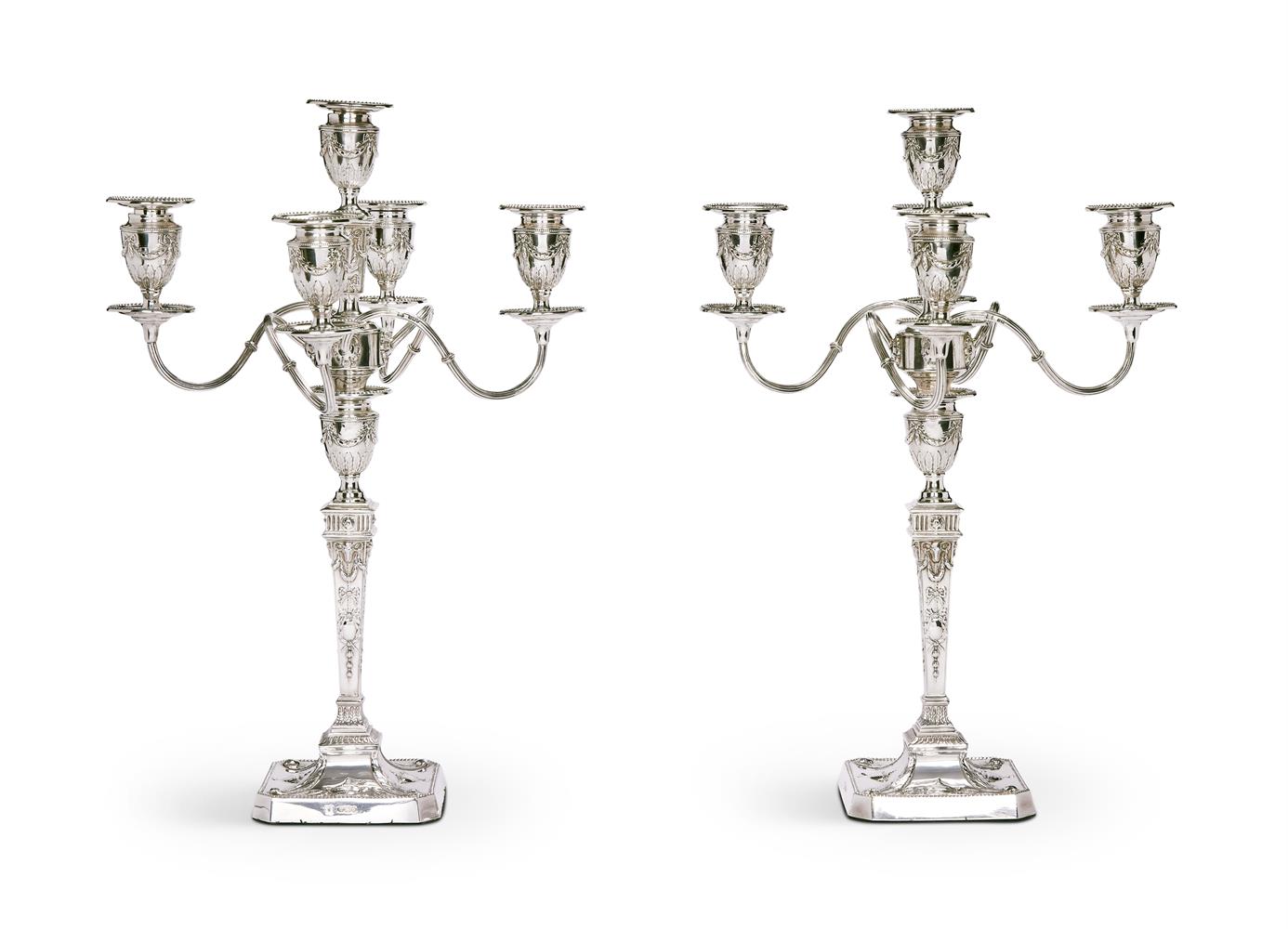 A CASED PAIR OF VICTORIAN SILVER FIVE LIGHT CANDELABRA