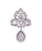 A DIAMOND LEAF SHAPED BROOCH/PENDANT WITH PEAR CUT DIAMOND CLUSTER DROP