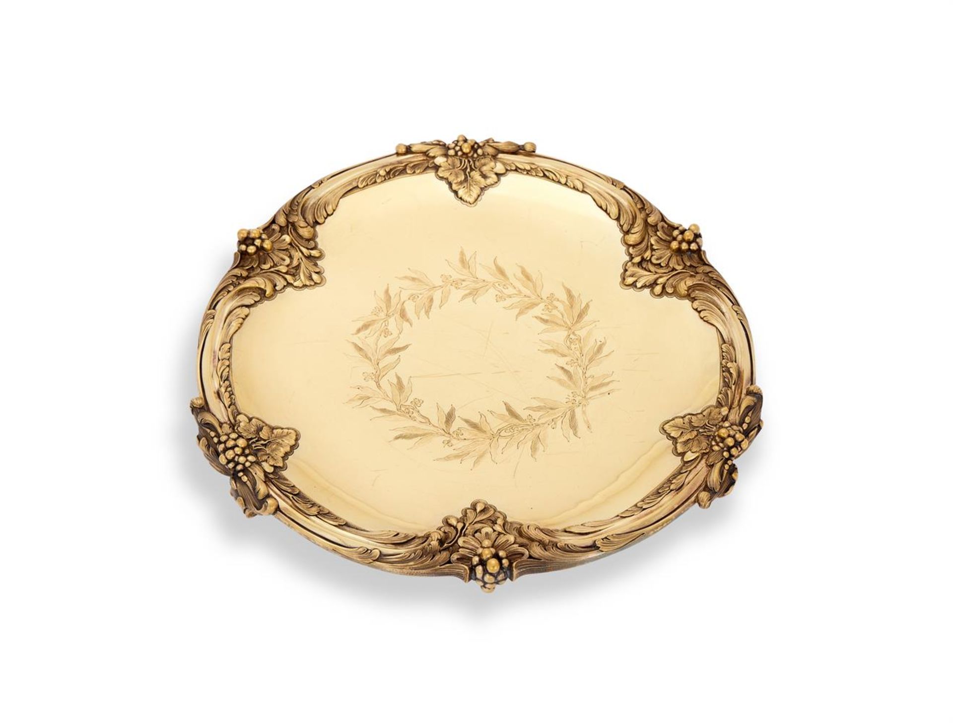 A FRENCH SILVER GILT SHAPED CIRCULAR SALVER