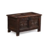 A CHARLES II OAK CHEST OR COFFER, CIRCA 1660