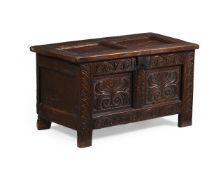 A CHARLES II OAK CHEST OR COFFER, CIRCA 1660