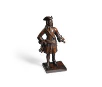 A RARE CARVED OAK MODEL OF A EUROPEAN MERCHANT OR ARMY OFFICER, 18TH CENTURY