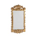 A GEORGE II CARVED GILTWOOD WALL MIRROR, CIRCA 1750