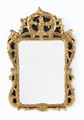 A CARVED GILTWOOD MIRROR, FRENCH OR IRISH, CIRCA 1770 AND PARTLY LATER PAINTED