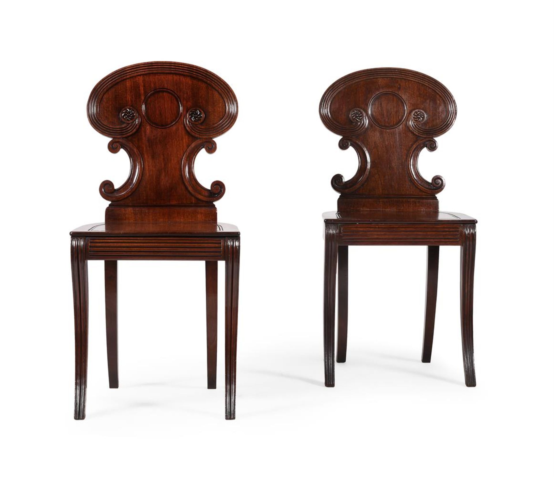 A PAIR OF REGENCY MAHOGANY HALL CHAIRS, ATTRIBUTED TO GILLOWS, CIRCA 1815