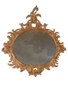 A CARVED GILTWOOD WALL MIRROR, IN THE MANNER OF LINNELL, 19TH CENTURY