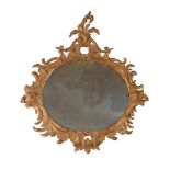 A CARVED GILTWOOD WALL MIRROR, IN THE MANNER OF LINNELL, 19TH CENTURY