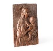 A TERRACOTTA PLAQUE OF THE MADONNA AND CHILD, ITALIAN, PROBABLY 18TH CENTURY
