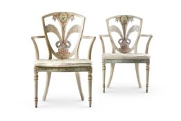 A MATCHED PAIR OF BEECH AND POLYCHROME PAINTED ELBOW CHAIRS, ONE CIRCA 1780 AND LATER REFRESHED