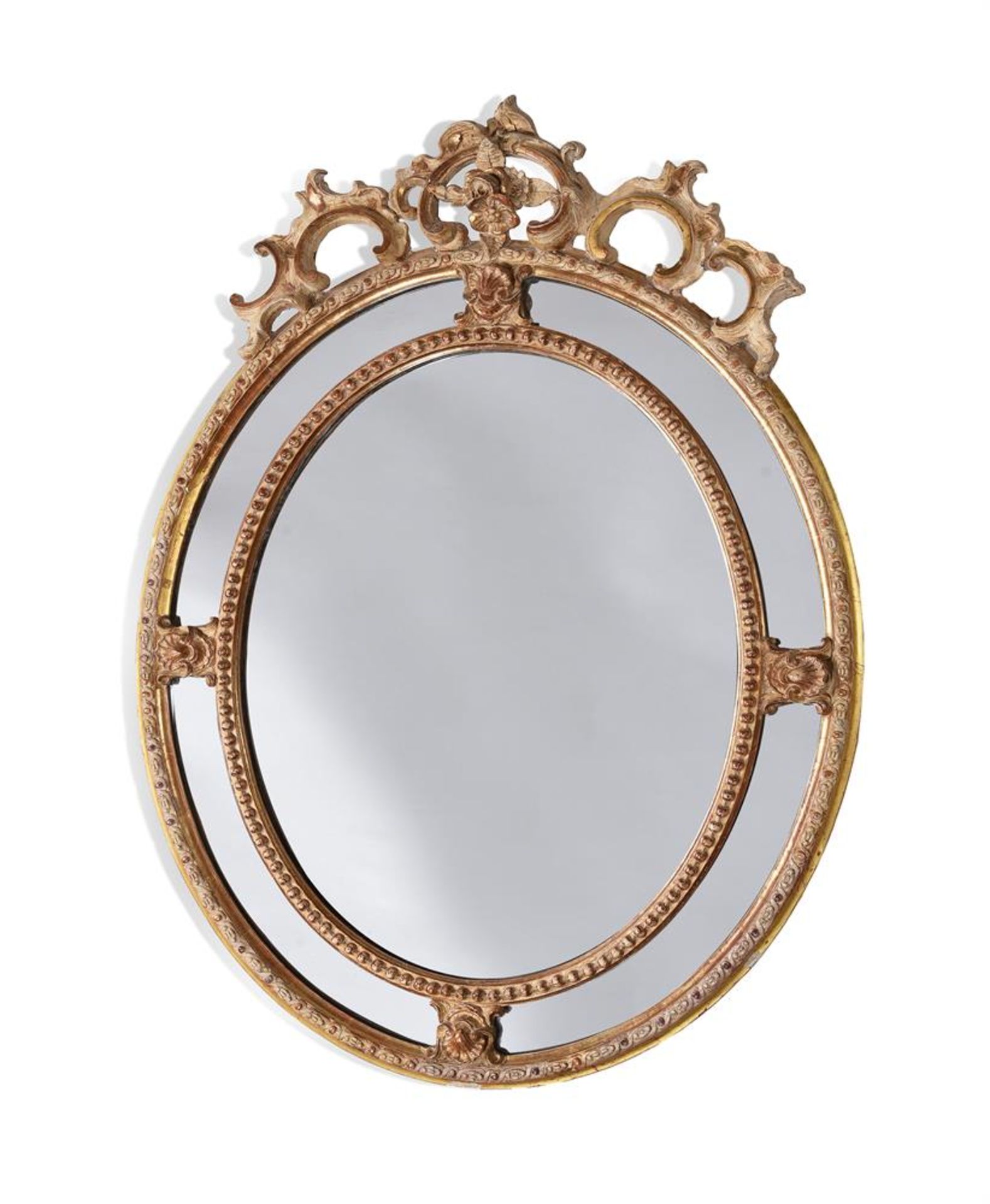 A FRENCH OVAL GILT GESSO MIRROR, IN LOUIS XV STYLE, 19TH CENTURY