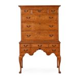 A GEORGE II BURR WALNUT, BURR OAK AND CHESTNUT CHEST ON STAND, MID 18TH CENTURY